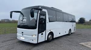 White executive touring coach for group travel across the United Kingdom